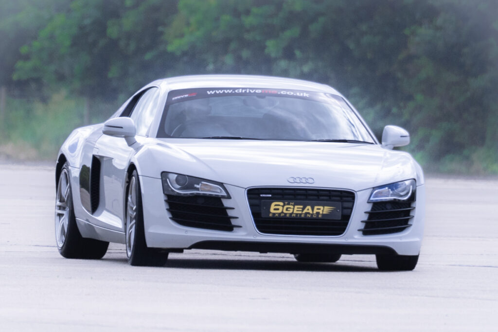 an Audi R8 driving around a race track for 6th Gear Experience