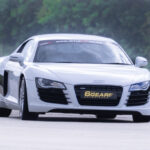 an Audi R8 driving around a race track for 6th Gear Experience