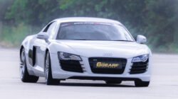 an Audi R8 driving around a race track for 6th Gear Experience