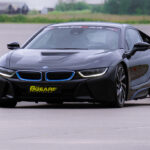 a BMW i8 driving around a race track for 6th Gear Experience